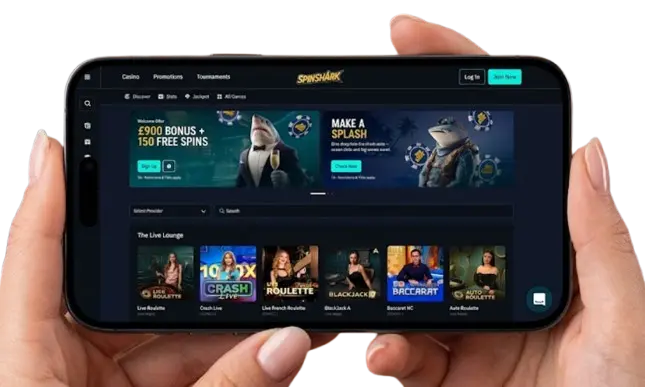 Hands holding a smartphone in landscape mode displaying the Spinshark mobile casino interface.